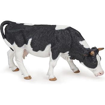 mucca Grazing bianca e nera